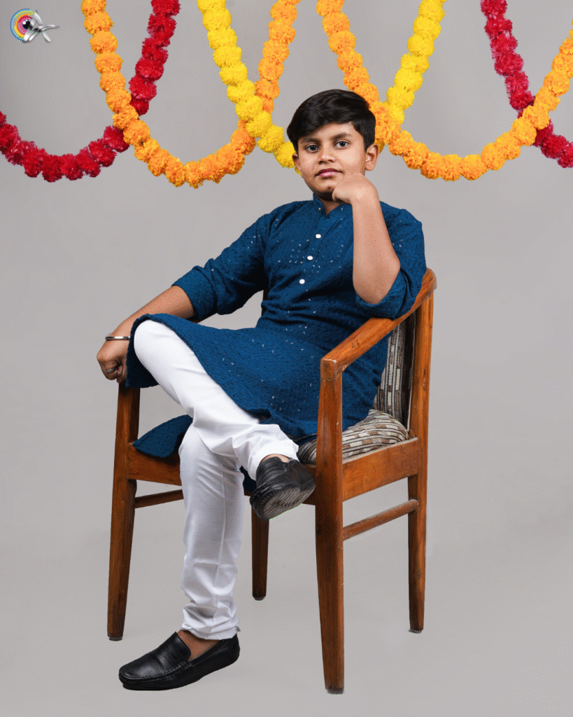 “Adorable infant dressed in ethnic attire for a festive photoshoot”